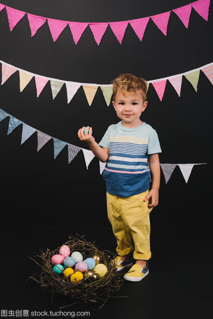 kid and easter eggs